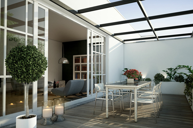 Ein mit Glas überdachter Wintergarten mit Schiebetür als Verbindung zum Wohnzimmer